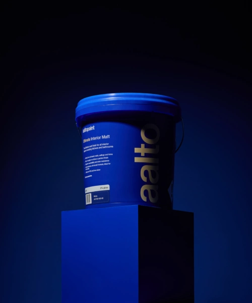 Bucket of Aalto paint sitting on plinth painted in ultramarine blue